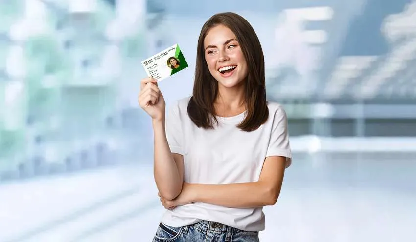 Happy Girl holding Los Angeles California medical Marijuana Card in Right Hand