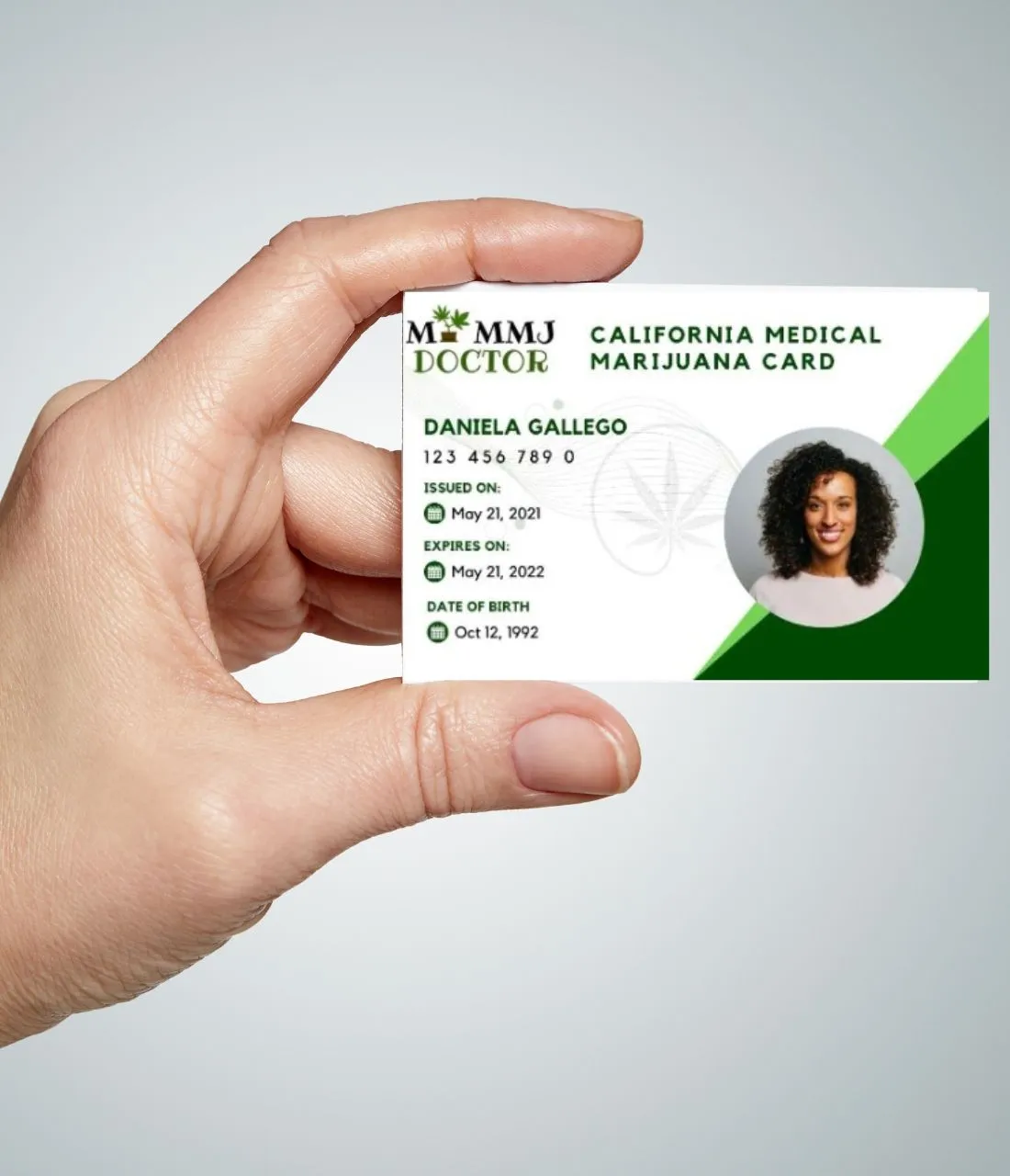 Hand holding Arizona medical cannabis card Hand holding Arizona medical cannabis card