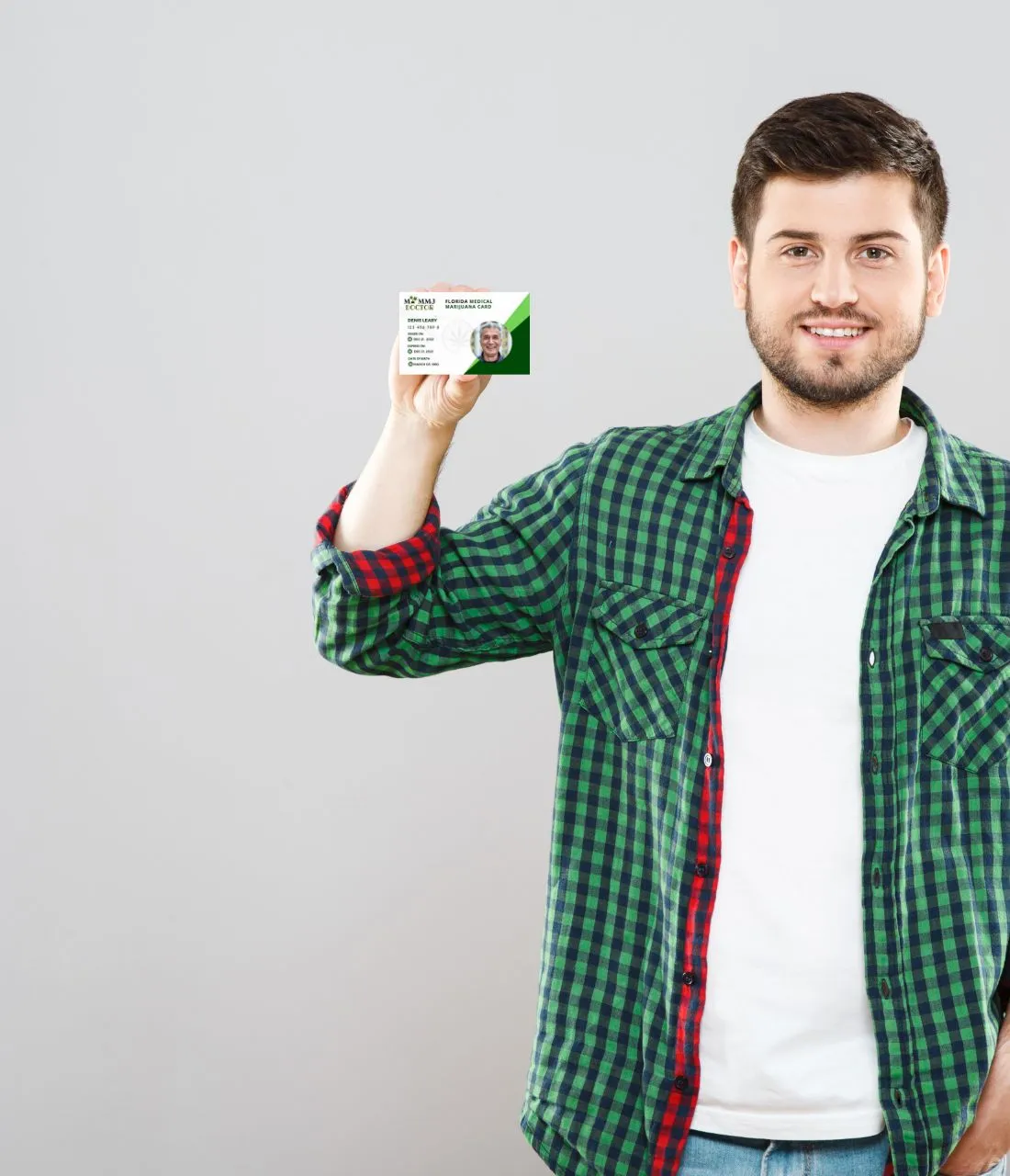 man holding florida medical marijuana card