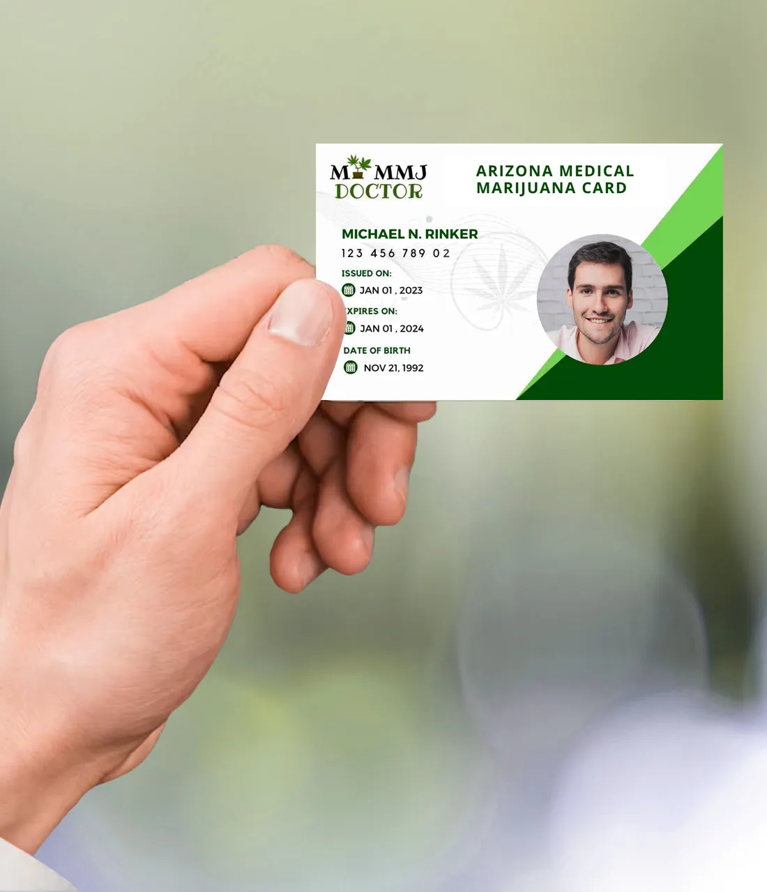 Hand holding Arizona medical cannabis card