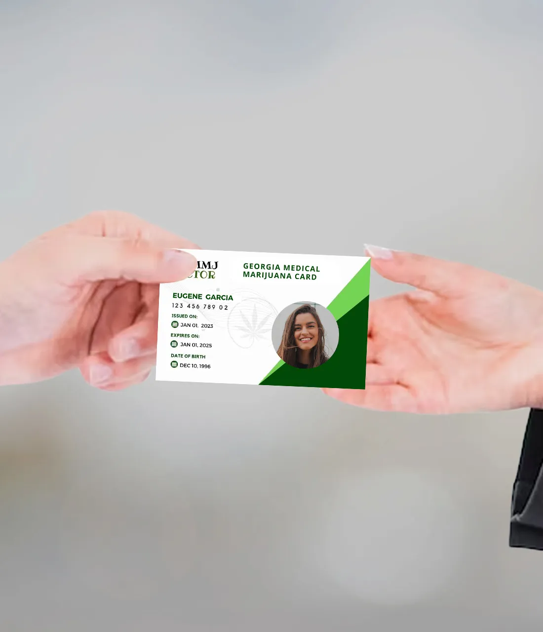 Hand Holding Georgia Medical Marijuana Card