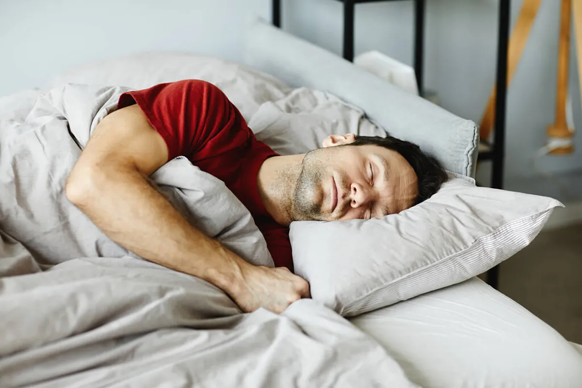man sleeping soundly to emphasize the importance of 7 to 9 hours of sleep while taking semaglutide for optimal results