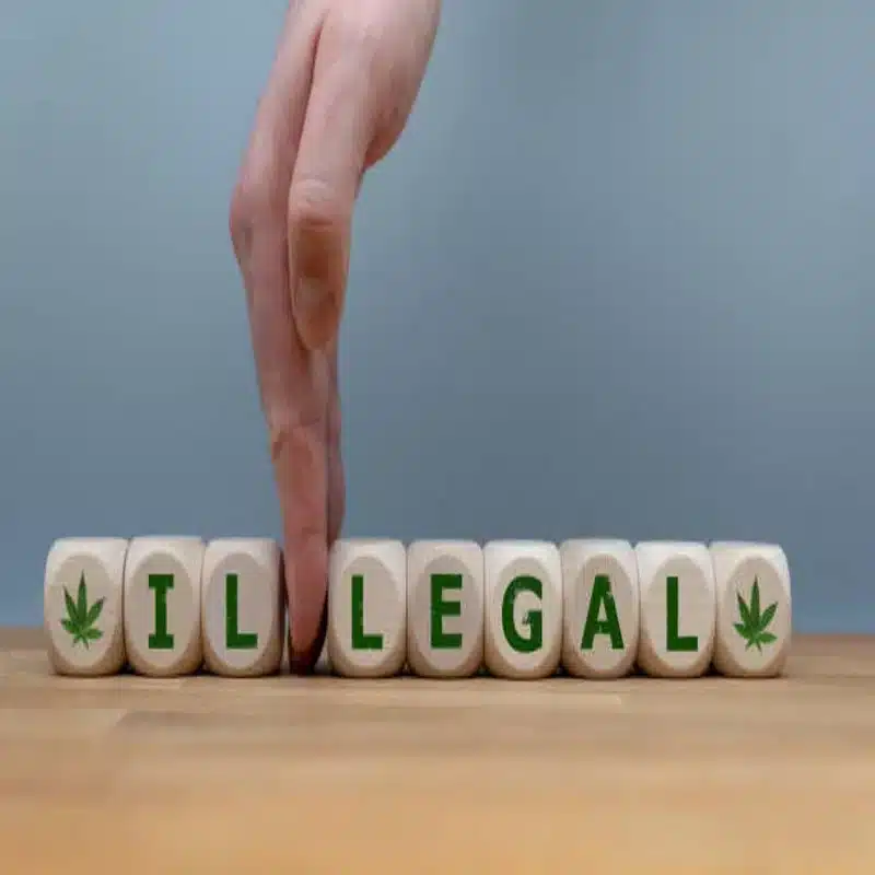 hand-removing-illegal-block-to-support-legal-cannabis-reform-and-legalization